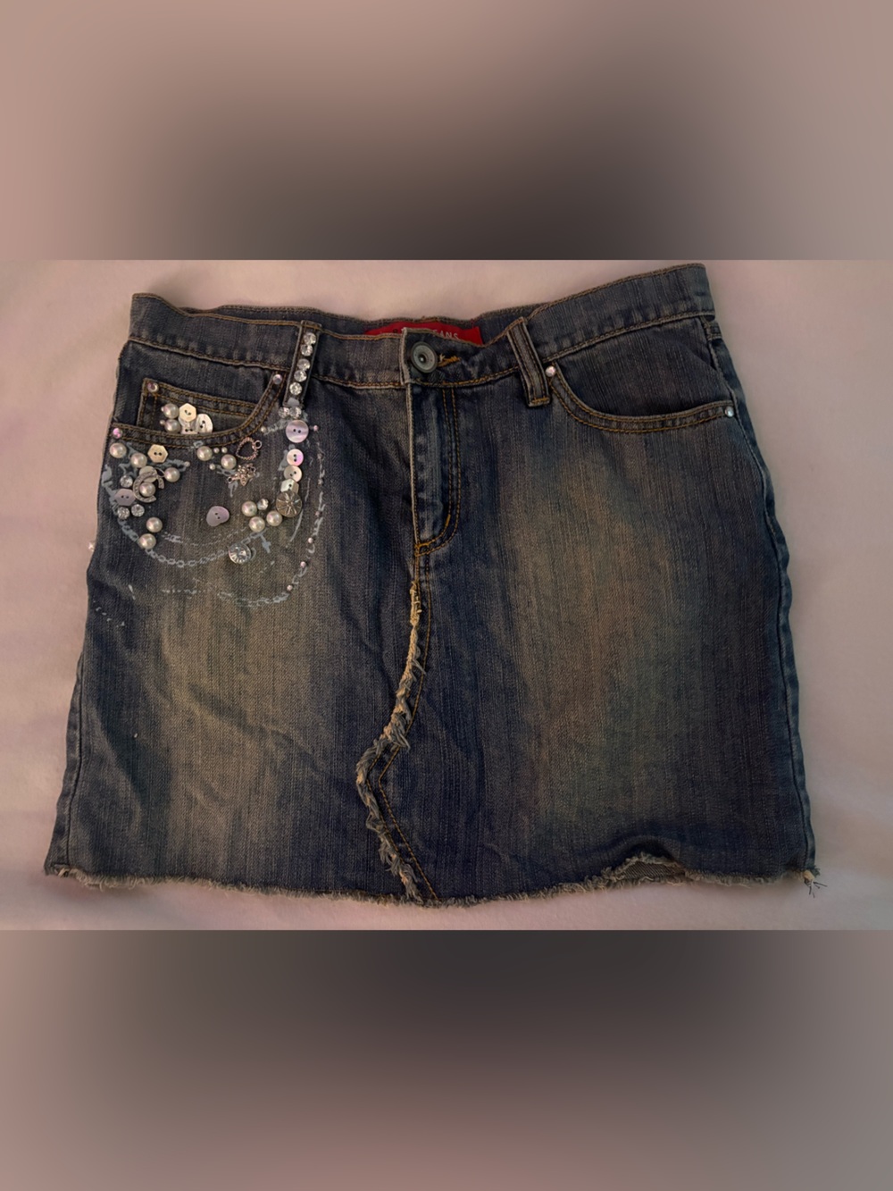 Y2K charm and button embellished skirt